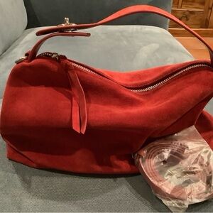 Red suede hobo bag with adjustable strap